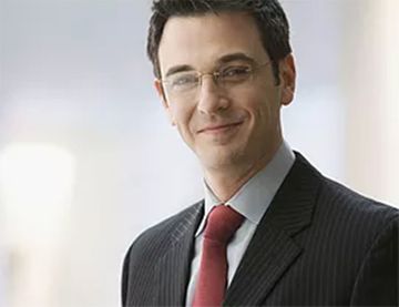 man in suit wearing glasses
