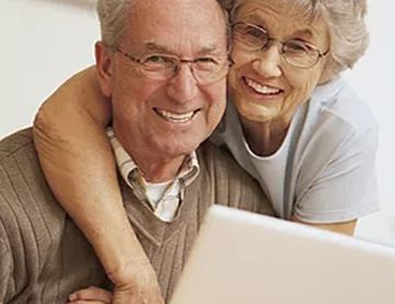 elderly couple wearing glasses