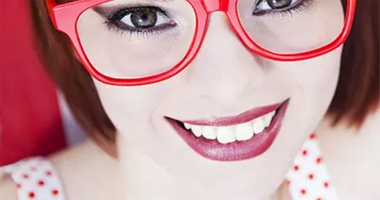 woman wearing red glasses